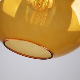 Moderne glazen hanglamp in ronde amberkleurige glazen kap met bubbeldesign